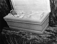 Baby corpse in a casket