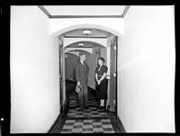 Couple in Narrow Hallway
