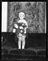 Portrait of a Boy Holding Flowers