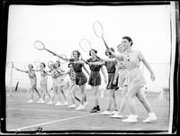 Women Taking a Group Tennis Lesson