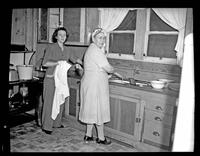 Two Women Washing Dishes