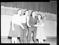 Two Couples Singing on Stage