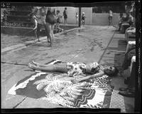 Woman Lying on a Pool Deck