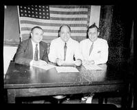 Group Portrait of Three Men at a Table