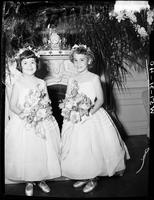 Portrait of Two Young Wedding Flower Girls