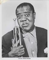 Louis Armstrong posed with trumpet