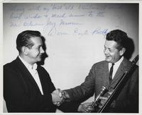 Warren Smith presenting his trombone to Bill Bacin