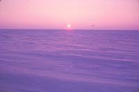 Sunset over snow-field