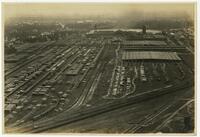 Aerial view of Great Southern Lumber Company showing railroad tracks, pond, etc.