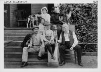 Portrait of Lytle family and firends on their front steps.