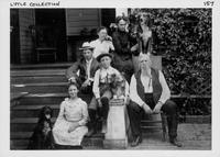 Portrait of Lytle family and firends on thier front steps.