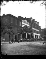Franklin St.: Exterior of L. Lowenberg, Grocer, and Pollock House.
