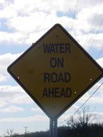 Water on road sign
