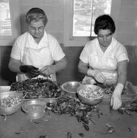 Women peeling crawfish