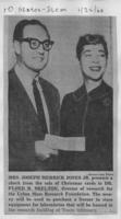 Mrs. Joseph Merrick Jones Jr. presents a check from the sale of Christmas cards