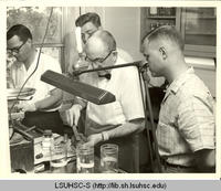Dr. W.R. Mathews with residents in pathology lab