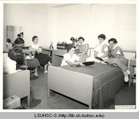 Nursing students playing records in a dorm room