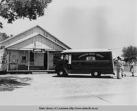 Louisiana State Library bookmobile stops outside Creole Belle store in Iberia Parish Louisiana in 1949