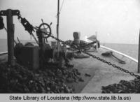 Harvesting oysters near Grand Isle in the Gulf of Mexico circa 1970