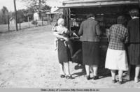 Patrons getting books as the  Natchitoches Parish Library bookmobile makes a stop in 1939