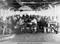 Prisoners dining at the levee camp at the Louisiana State Penitentiary in Angola Louisiana circa 1901