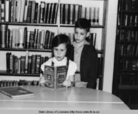 Children reading at the Natchitoches Parish Library in Natchitoches Parish Louisiana in the 1940s