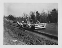 Men using highway Equipment to build road