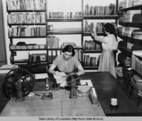Librarian Vivian Cazayoux with a library assistant at the state library in Baton Rouge Louisiana circa 1940s