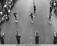 Majorettes twirl batons at the Yambilee Festival parade in Opelousas Louisiana in 1970