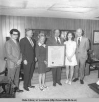 Secretary of State Wade O. Martin and others holding a framed document in Baton Rouge Louisiana circa 1971