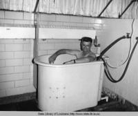 Man taking a sitz bath at Hot Wells Health Resort near Boyce Louisiana