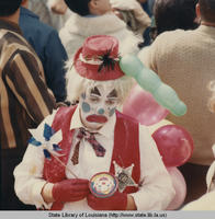 Person in clown costume at the Rex Parade at Mardi Gras in New Orleans Louisiana in 1968