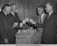 Men with prize winning navel oranges at the Orange Festival in Buras Louisiana in 1948