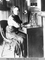 Telephone operator at her station in Bushnell Illinois in 1909
