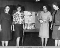 Librarian Vivian Cazayoux presents a program to the Eunice Catholic Daughters of America at the Saint Landry Parish library in Eunice Louisiana in 1965