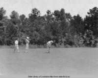 Three men playing golf in Louisiana in the 1920s