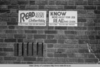 Signs promoting reading at the demonstration library in Bossier Parish Louisiana circa 1950s