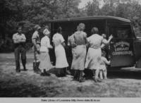 People gathered around the first bookmobile in the Winn and Jackson parishes area in 1937