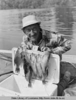 Bob Scearce with his bass catch at Old River in Louisiana in the 1970s