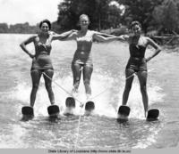 Three women water skiing on Lake Providence near Lake Providence Louisiana in the 1940s
