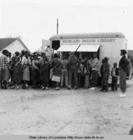 African American children lined up to enter the bookmobile for Richland Parish Louisiana in 1953