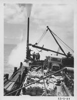 Working on well in Vermilion Bay and xmas tree equipment being turnbuckled down on June 11, 1938 at 12:50am