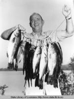 Man with fish at Toledo Bend  Reservoir in Western Louisiana circa 1968
