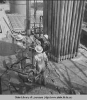 Roughnecks working on an oil rig in Natchez Mississippi in 1944