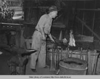 Blacksmithing shop in Abbeville Louisiana in 1938.