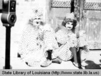 Couple in clown costumes at Mardi Gras in New Orleans in 1965