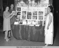 Librarians with an exhibit for the public library in Caldwell Parish Louisiana in the 1960s