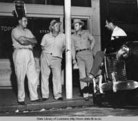 Humble oil workers Wilson Black and J.E. Cox and others in front of Tops Restaurant in Natchez Louisiana in 1944