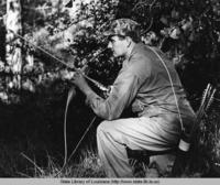 Man hunting with bow and arrow in North Louisiana circa 1971