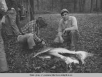 Biologist Dan Darmett checking deer killed by BW Gray of Sterlington Louisiana